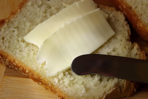 Sandwich with butter and knife — Stock Photo, Image