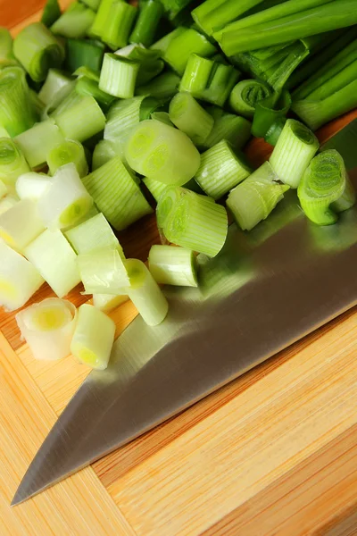 Green onions, sliced on the board — Stock Photo, Image