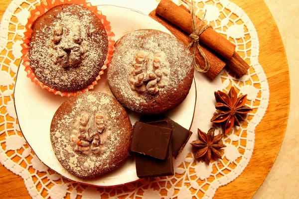 Chocolate muffins, dusted with icing sugar — Stock Photo, Image