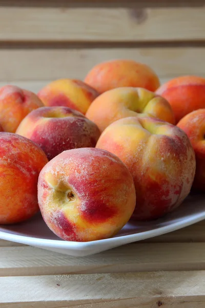 Ripe peaches on a plate — Stock Photo, Image