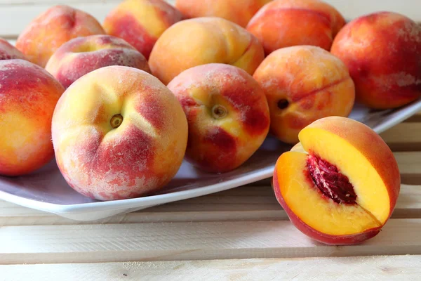 Ripe peaches on a plate — Stock Photo, Image