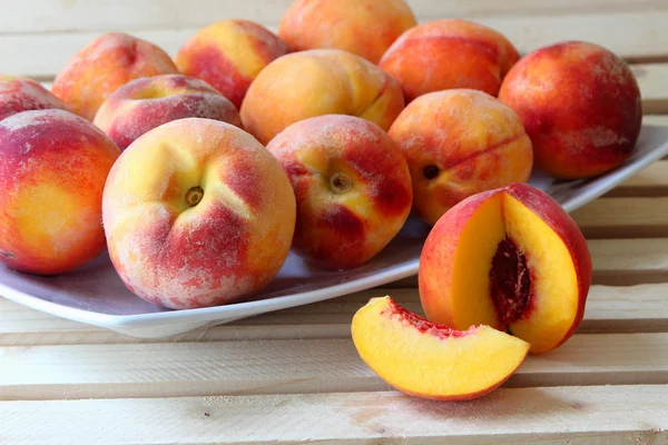 Ripe peaches on a plate — Stock Photo, Image