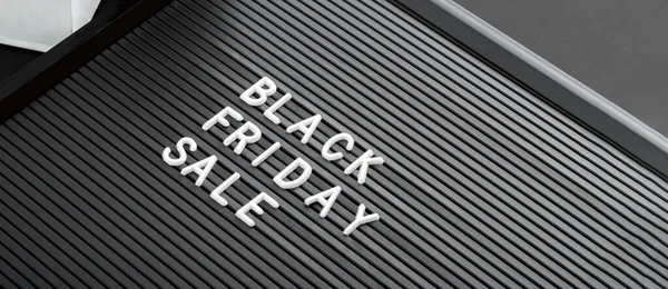 Black Friday sale white text lettering on black background of Letter Board. Black and white letters message promotion banner. Long web banner with copy space