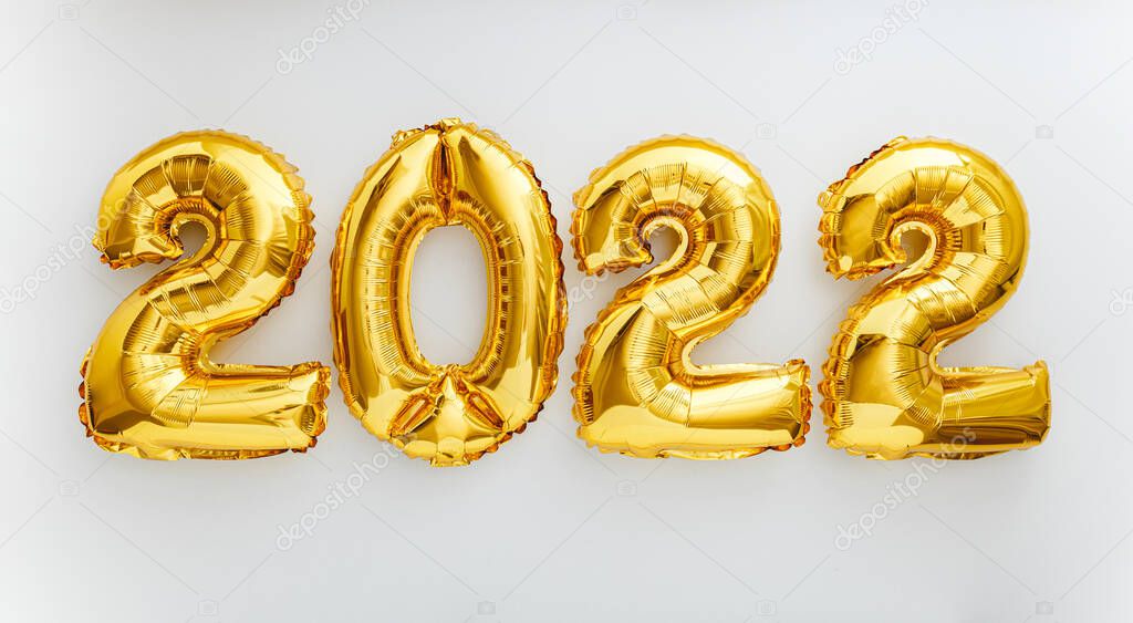 2022 balloon text on white background. Happy New year eve invitation with Christmas gold foil balloons 2022. Flat lay long web banner