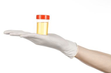 Medical theme: doctor's hand in white gloves holding a transparent container with the analysis of urine on a white background clipart