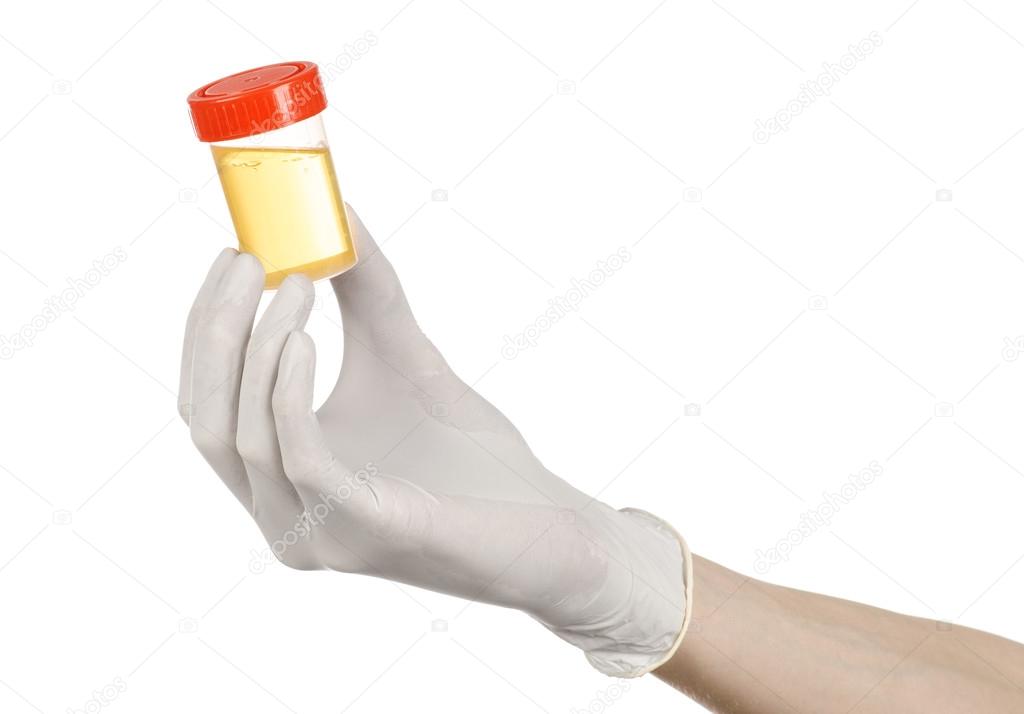 Medical theme: doctor's hand in white gloves holding a transparent container with the analysis of urine on a white background