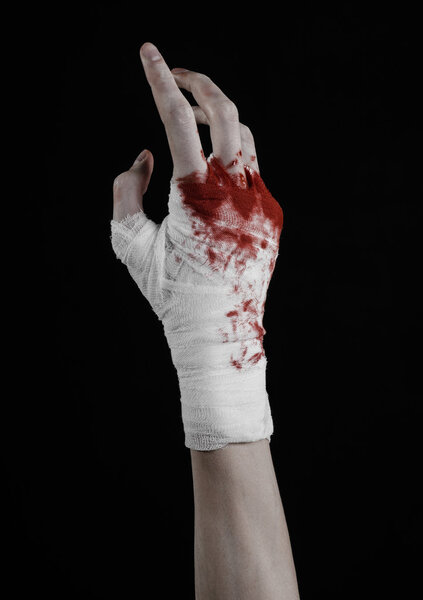 Shook his bloody hand in a bandage, bloody bandage, fight club, street fight, violence, bloody theme, isolated, bloody fists, boxer, tied his hands with a bandage, black background