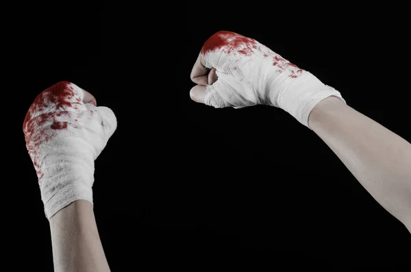 Shook his bloody hand in a bandage, bloody bandage, fight club, street fight, violence, bloody theme, isolated, bloody fists, boxer, tied his hands with a bandage, black background — Stock Photo, Image