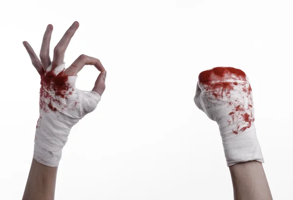 Shook his bloody hand in a bandage, bloody bandage, fight club, street fight, violence, bloody theme, black background, isolated, bloody fists, boxer, tied his hands with a bandage, white background — Stock Photo, Image