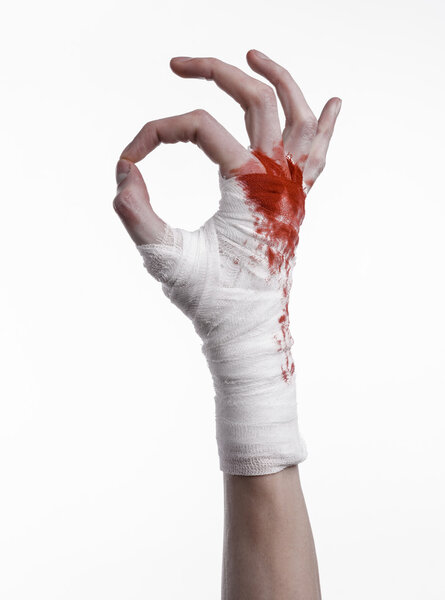 shook his bloody hand in a bandage, bloody bandage, fight club, street fight, violence, bloody theme, black background, isolated, bloody fists, boxer, tied his hands with a bandage, white background