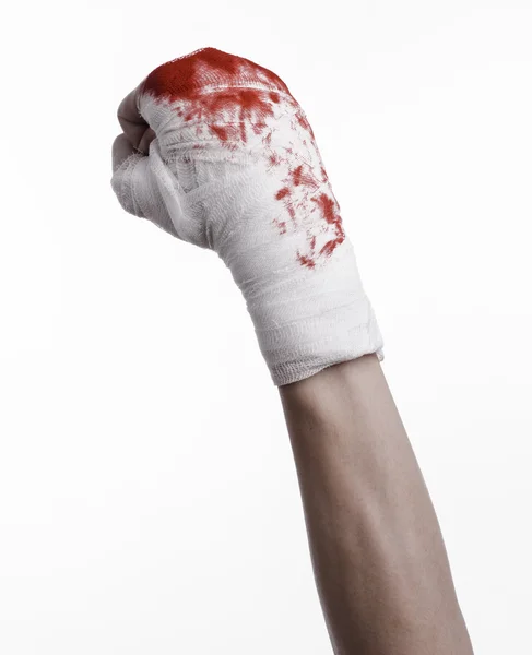 Shook his bloody hand in a bandage, bloody bandage, fight club, street fight, violence, bloody theme, black background, isolated, bloody fists, boxer, tied his hands with a bandage, white background — Stock Photo, Image