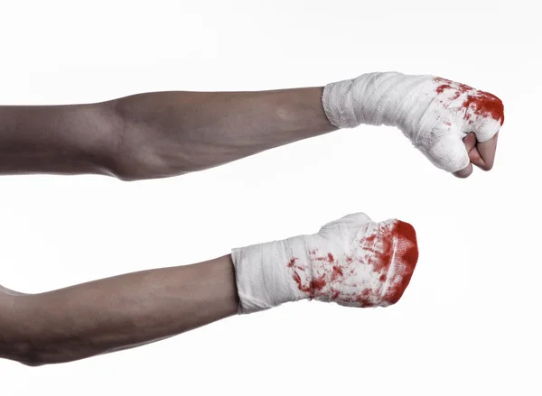 Shook his bloody hand in a bandage, bloody bandage, fight club, street fight, violence, bloody theme, black background, isolated, bloody fists, boxer, tied his hands with a bandage, white background — Stock Photo, Image