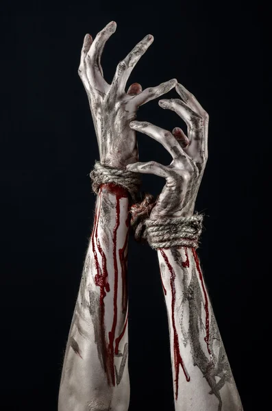 Hands bound,bloody hands, mud, rope, on a black background, isolated, kidnapping, zombie, demon — Stock Photo, Image