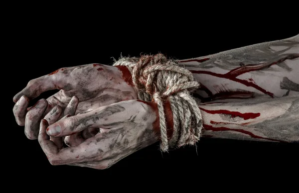 Hände gebunden, blutige Hände, Schlamm, Seil, auf schwarzem Hintergrund, isoliert, Entführung, Zombie, Dämon — Stockfoto