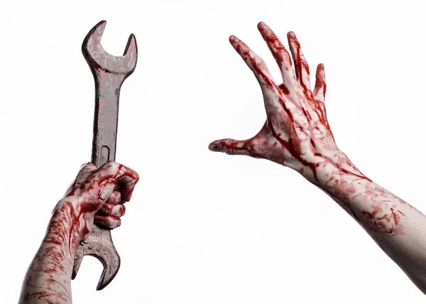 Bloody hand holding a big wrench, bloody wrench, big key, bloody theme, halloween theme, crazy mechanic, murderer, psycho, violence, zombies, white background, isolated, revolution — Stock Photo, Image