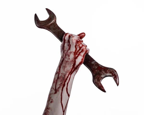 Bloody hand holding a big wrench, bloody wrench, big key, bloody theme, halloween theme, crazy mechanic, murderer, psycho, violence, zombies, white background, isolated, revolution — Stock Photo, Image