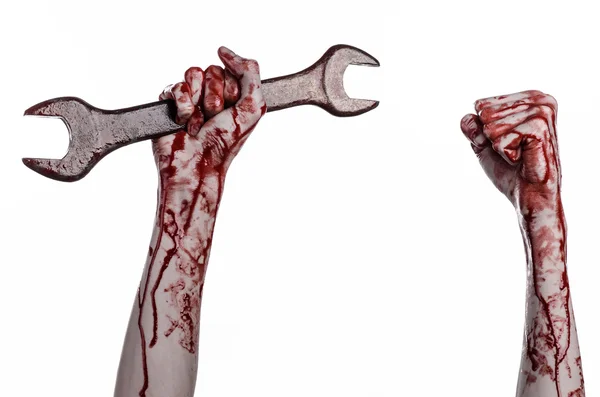 Bloody hand holding a big wrench, bloody wrench, big key, bloody theme, halloween theme, crazy mechanic, murderer, psycho, violence, zombies, white background, isolated, revolution — Stock Photo, Image