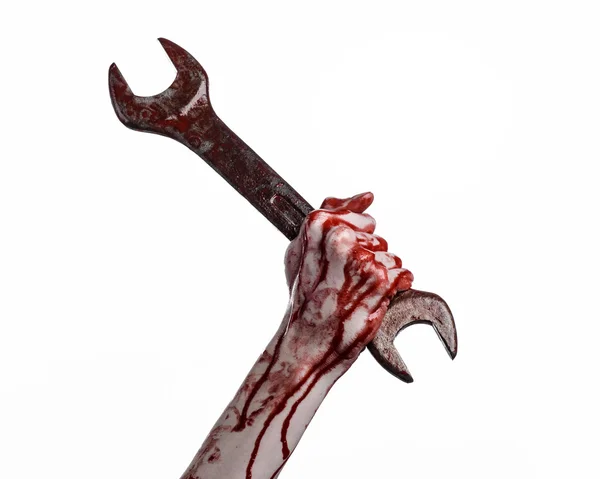 Bloody hand holding a big wrench, bloody wrench, big key, bloody theme, halloween theme, crazy mechanic, murderer, psycho, violence, zombies, white background, isolated, revolution — Stock Photo, Image