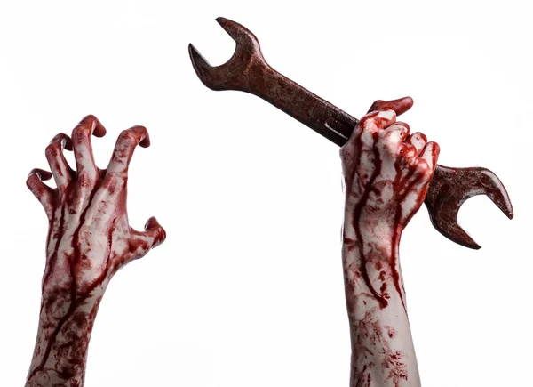 Bloody hand holding a big wrench, bloody wrench, big key, bloody theme, halloween theme, crazy mechanic, murderer, psycho, violence, zombies, white background, isolated, revolution — Stock Photo, Image
