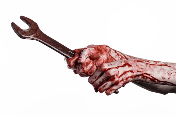 Bloody hand holding a big wrench, bloody wrench, big key, bloody theme, halloween theme, crazy mechanic, murderer, psycho, violence, zombies, white background, isolated, revolution — Stock Photo, Image