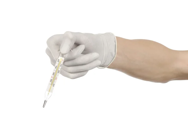 Medical theme: doctor's hand in white gloves holding a thermometer to measure the temperature of the patient on a white background — Stock Photo, Image