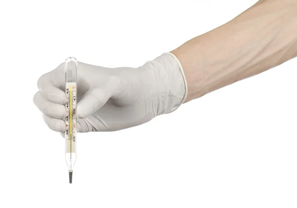 Medical theme: doctor's hand in white gloves holding a thermometer to measure the temperature of the patient on a white background — Stock Photo, Image