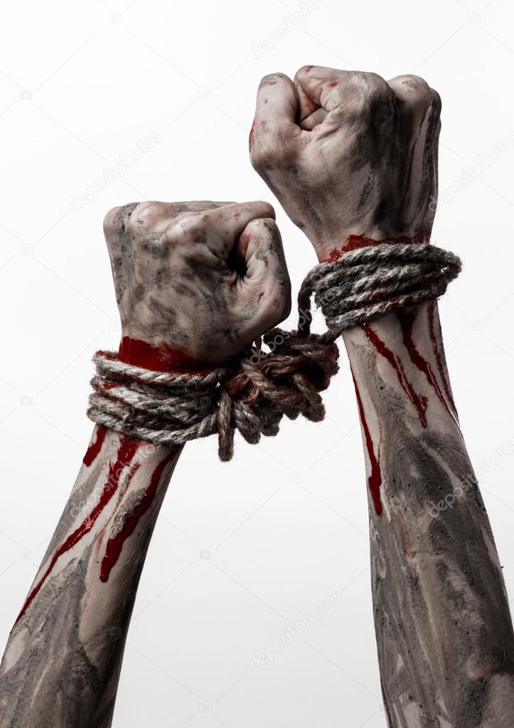 Hands bound,bloody hands, mud, rope, on a white background, isolated, kidnapping, zombie, demon