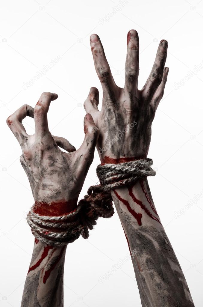 Hands bound,bloody hands, mud, rope, on a white background, isolated, kidnapping, zombie, demon