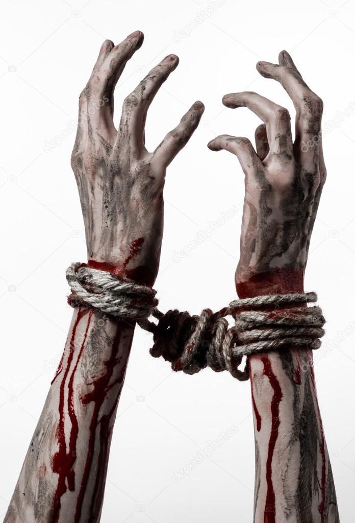 Hands bound,bloody hands, mud, rope, on a white background, isolated, kidnapping, zombie, demon