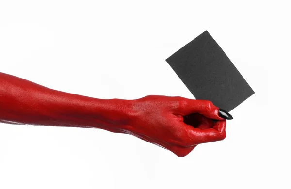 Halloween theme: Red devil hand with black nails holding a blank black card on a white background — Stock Photo, Image