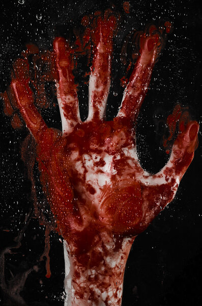 The bloody hand on the wet glass, the bloody window, an imprint of bloody hands, zombie, demon, killer, horror