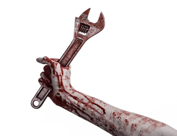 Tema de Halloween: mano sangrienta sosteniendo una llave grande sobre un fondo blanco — Foto de Stock