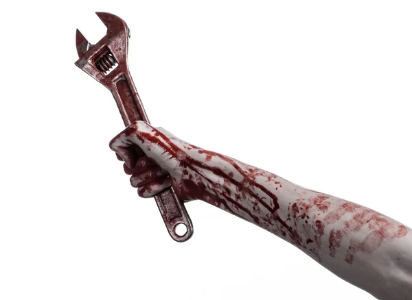 Halloween theme: bloody hand holding a big wrench on a white background — Stock Photo, Image