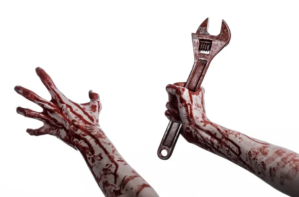 Halloween thema: bloedige hand met een grote sleutel op een witte achtergrond — Stockfoto