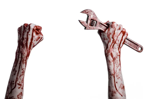 Halloween-Thema: Blutige Hand mit einem großen Schraubenschlüssel auf weißem Hintergrund — Stockfoto