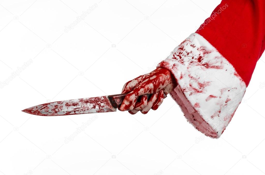 Christmas and Halloween theme: Santa's bloody hands of a madman holding a bloody knife on an isolated white background
