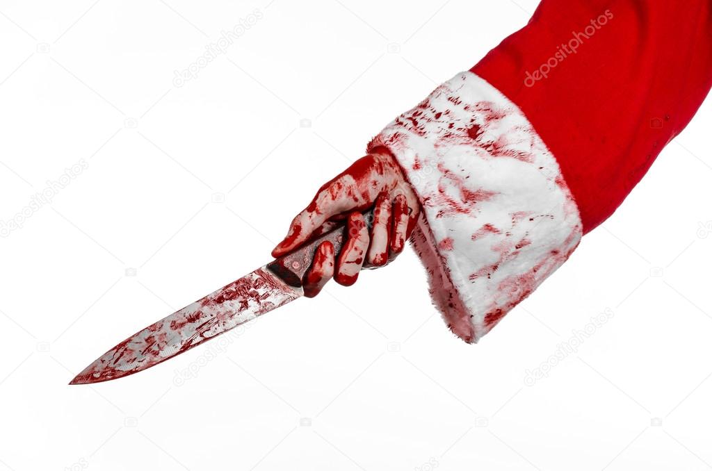 Christmas and Halloween theme: Santa's bloody hands of a madman holding a bloody knife on an isolated white background