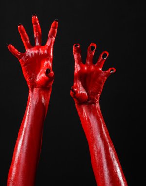 Halloween Tema, siyah arka plan, izole kırmızı şeytan'ın eller, kırmızı eller şeytanın