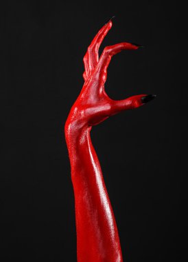 Halloween Tema, siyah arka plan, izole kırmızı şeytan'ın eller, kırmızı eller şeytanın