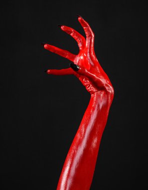 Halloween Tema, siyah arka plan, izole kırmızı şeytan'ın eller, kırmızı eller şeytanın