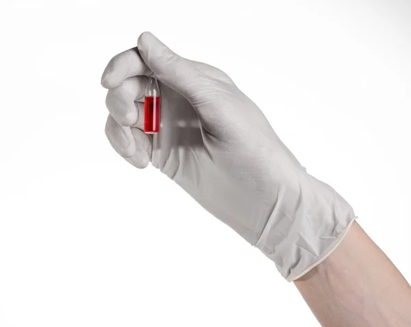 Doctor hand holding a vial, ampule red, vaccine ampule, Ebola vaccine, flu treatment, white background, isolated, gloved hand holding a vial, cancer vaccine, a vaccine against Ebola — Stock Photo, Image