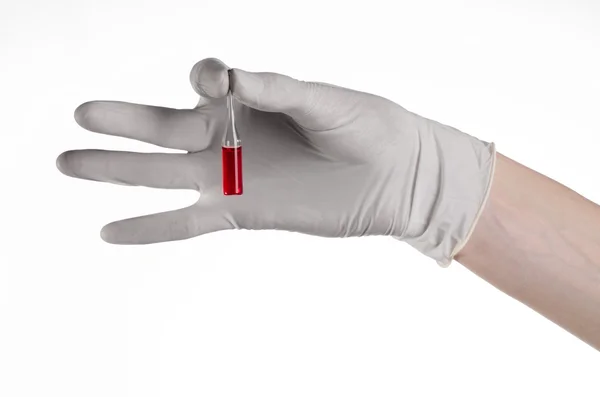 Doctor hand holding a vial, ampule red, vaccine ampule, Ebola vaccine, flu treatment, white background, isolated, gloved hand holding a vial, cancer vaccine, a vaccine against Ebola — Stock Photo, Image