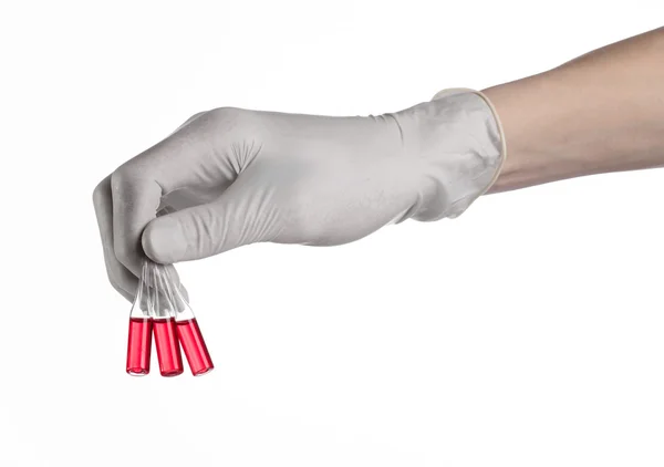 Doctor hand holding a vial, ampule red, vaccine ampule, Ebola vaccine, flu treatment, white background, isolated, gloved hand holding a vial, cancer vaccine, a vaccine against Ebola — Stock Photo, Image