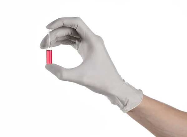 Doctor hand holding a vial, ampule red, vaccine ampule, Ebola vaccine, flu treatment, white background, isolated, gloved hand holding a vial, cancer vaccine, a vaccine against Ebola — Stock Photo, Image