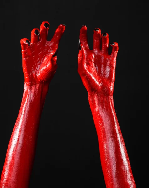 Mani del Diavolo Rosso, mani rosse di Satana, tema Halloween, sfondo nero, isolato — Foto Stock