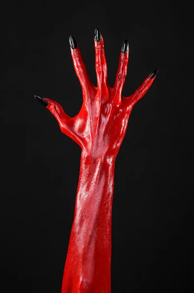 Κόκκινο διαβόλου χέρια, κόκκινο τα χέρια του Σατανά, θέμα αποκριών, μαύρο φόντο, απομονωμένο — Φωτογραφία Αρχείου