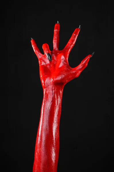 Manos del diablo rojo, manos rojas de Satanás, tema de Halloween, fondo negro, aislado —  Fotos de Stock