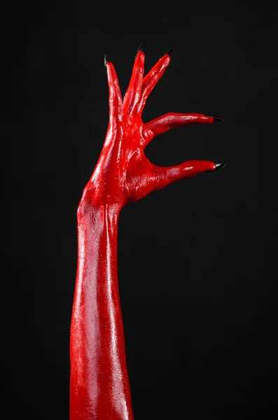 Mani del Diavolo Rosso, mani rosse di Satana, tema Halloween, sfondo nero, isolato — Foto Stock