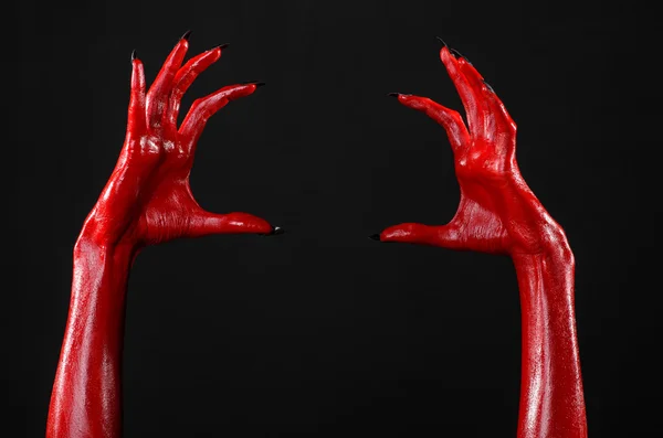 Manos del diablo rojo, manos rojas de Satanás, tema de Halloween, fondo negro, aislado —  Fotos de Stock