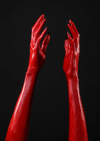 Mani del Diavolo Rosso, mani rosse di Satana, tema Halloween, sfondo nero, isolato — Foto Stock